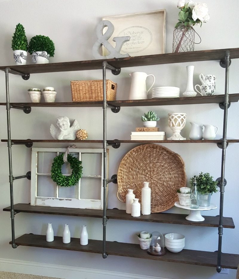 DIY industrial pipe shelves create pretty pictures