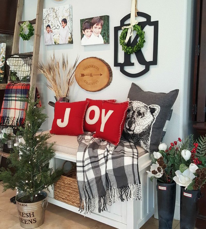 inspired Christmas decor with plaid throws and joy pillows