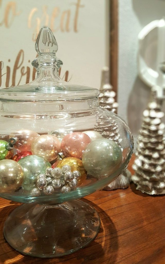 Antique glass ornaments add sparkle glitter and shine to this Christmas centerpiece