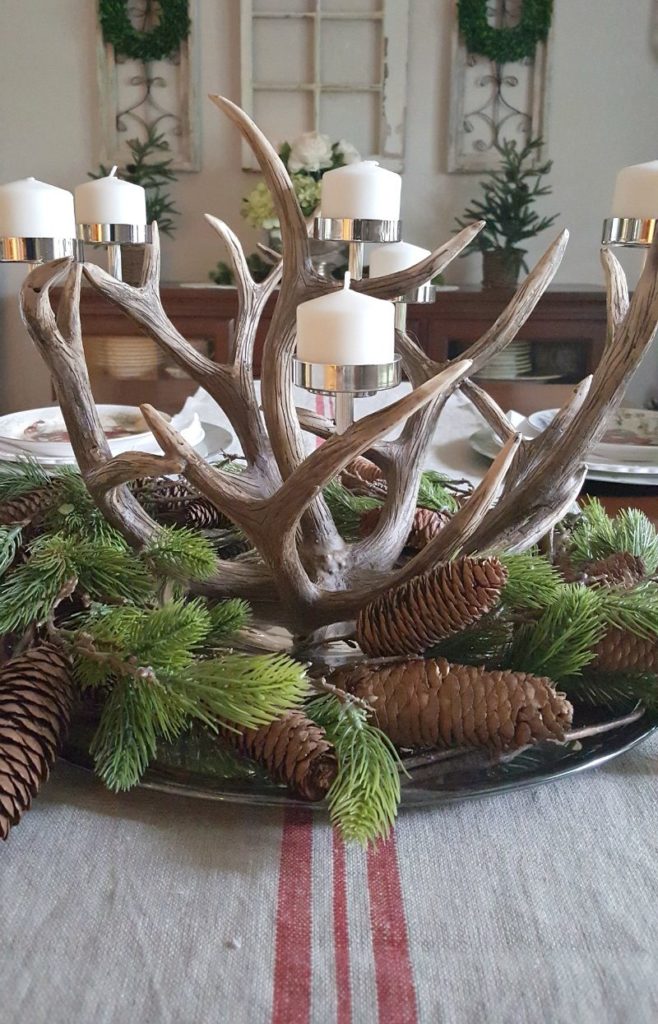 An antler candelabrum is the perfect rustic centerpiece for this natural inspired Christmas decor