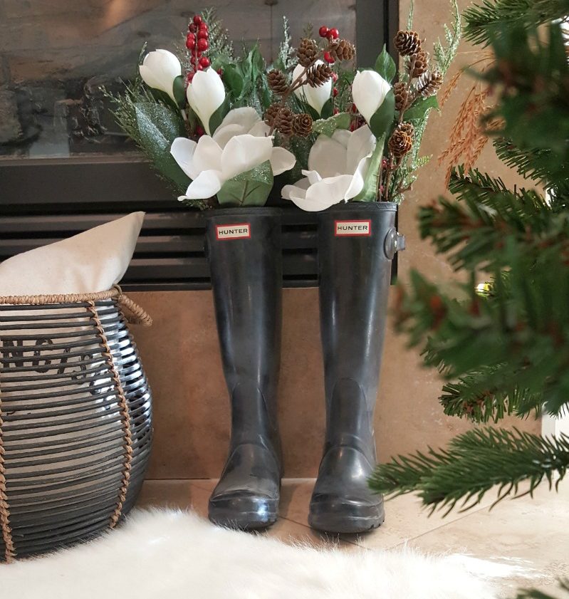 Holiday botanicals, magnolias and berries, pinecones and evergreens are beautiful, natural decor and rainboots as decor