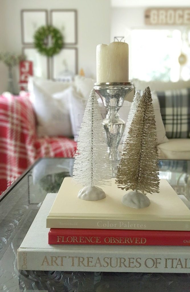 essential decor elements with books and mini trees and candle holders