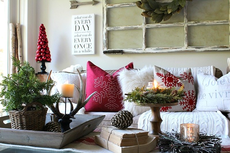 farmhouse elements like reclaimed wood, antlers and rustic window add style and fun to holiday decor