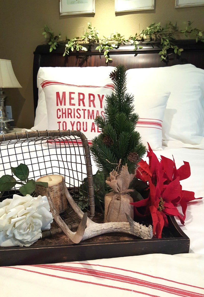 holiday bedroom decor with evergreen and rustic details