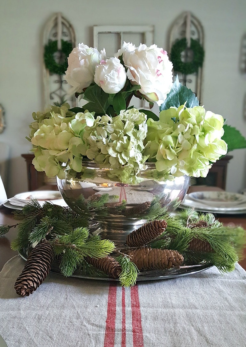Dining room floral centerpiece with antique farmhouse table runner