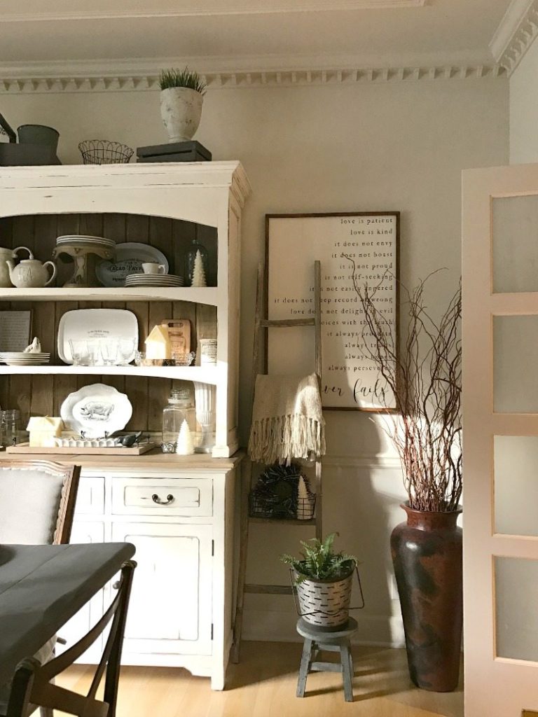 farmhouse hutch layered with handmade sign, vintage ladder details