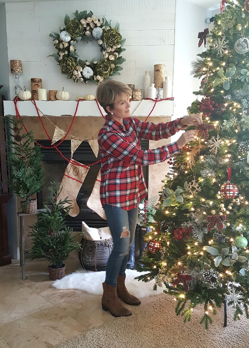 traditional rustic inspired Christmas decor Jodie decorating the tree