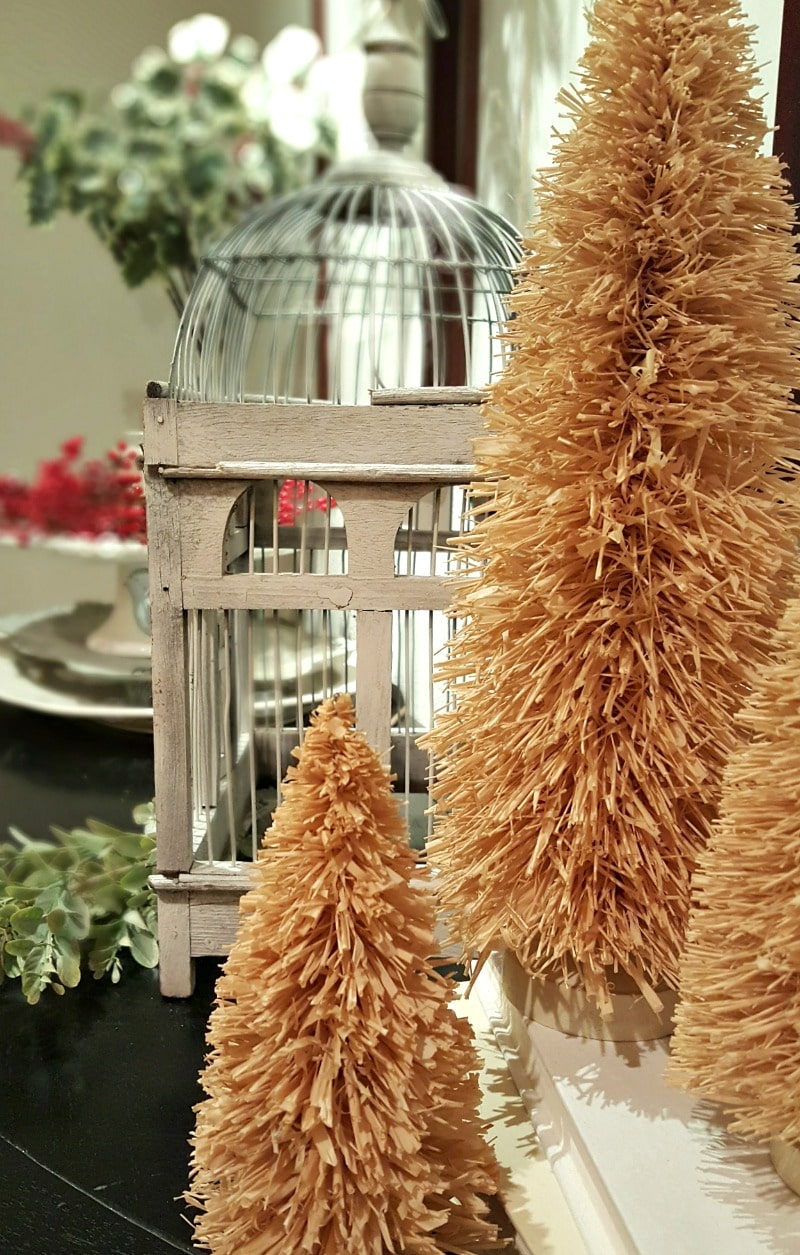 unique inspiring Christmas decor with bird cage and mini trees