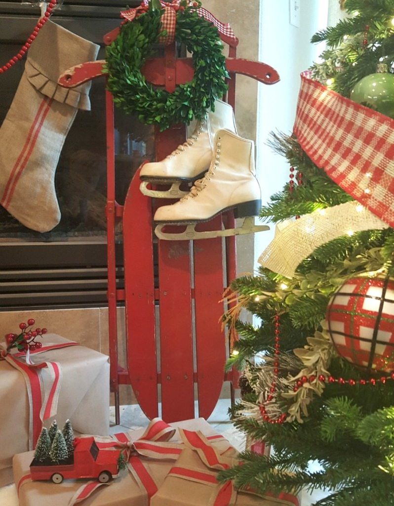 antique red chippy sled and white vintage ice skates add vintage charm