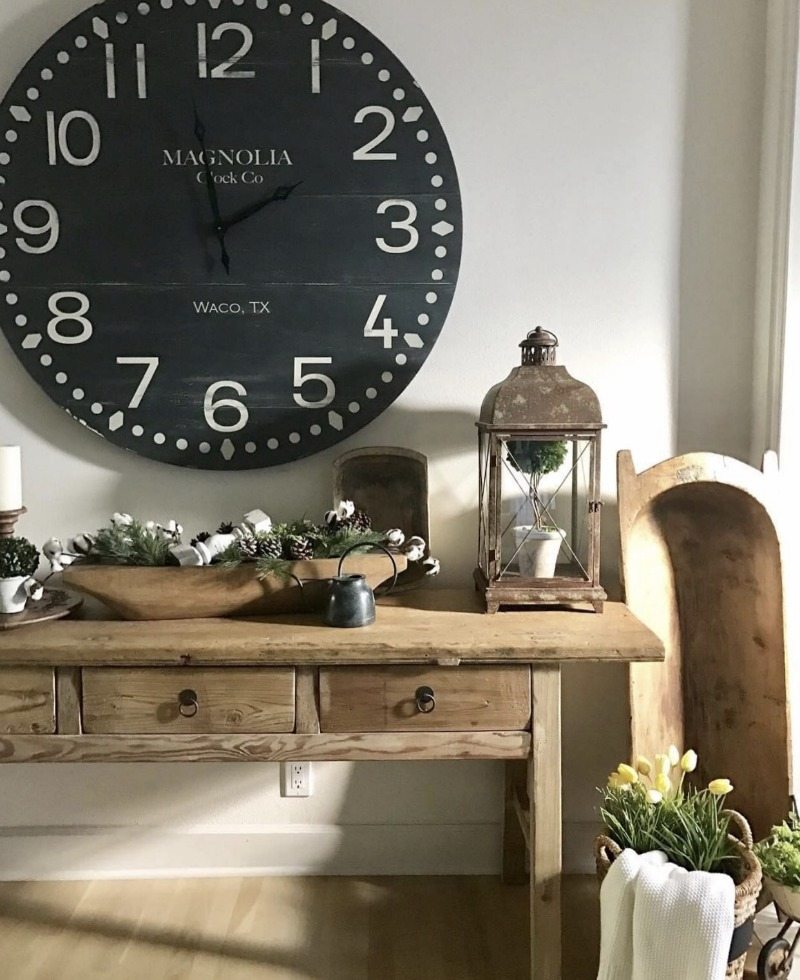 magnolia clock above farmhouse table entryway decorating ideas