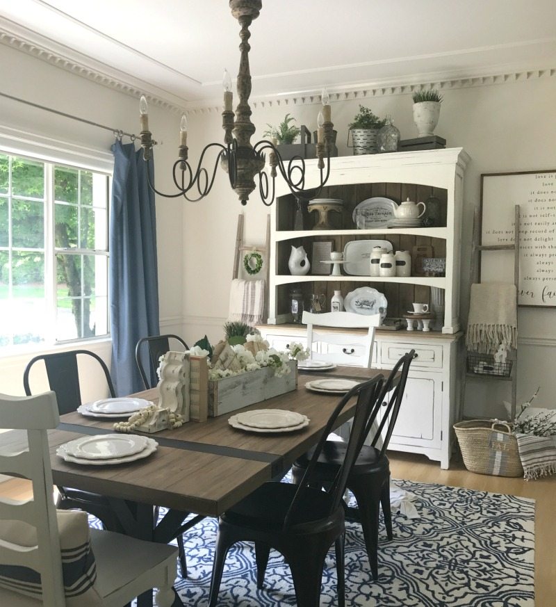 Farmhouse Dining room with farmhouse table and chandelier