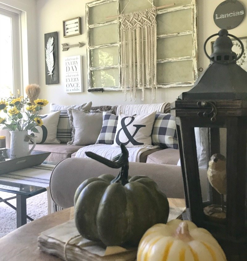 decorate for fall with neutrals and pumpkins in your family room