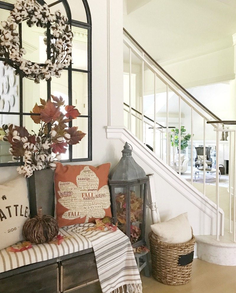 Fall Decorating with pillows wreaths and warm colors on bench