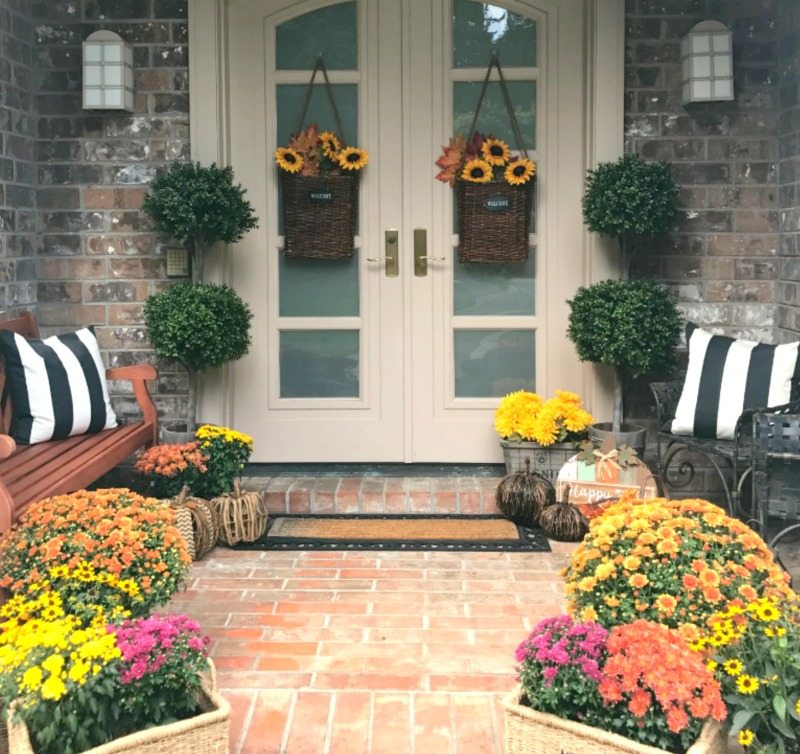 professional decor tips for fall front porch with mums and sunflowers