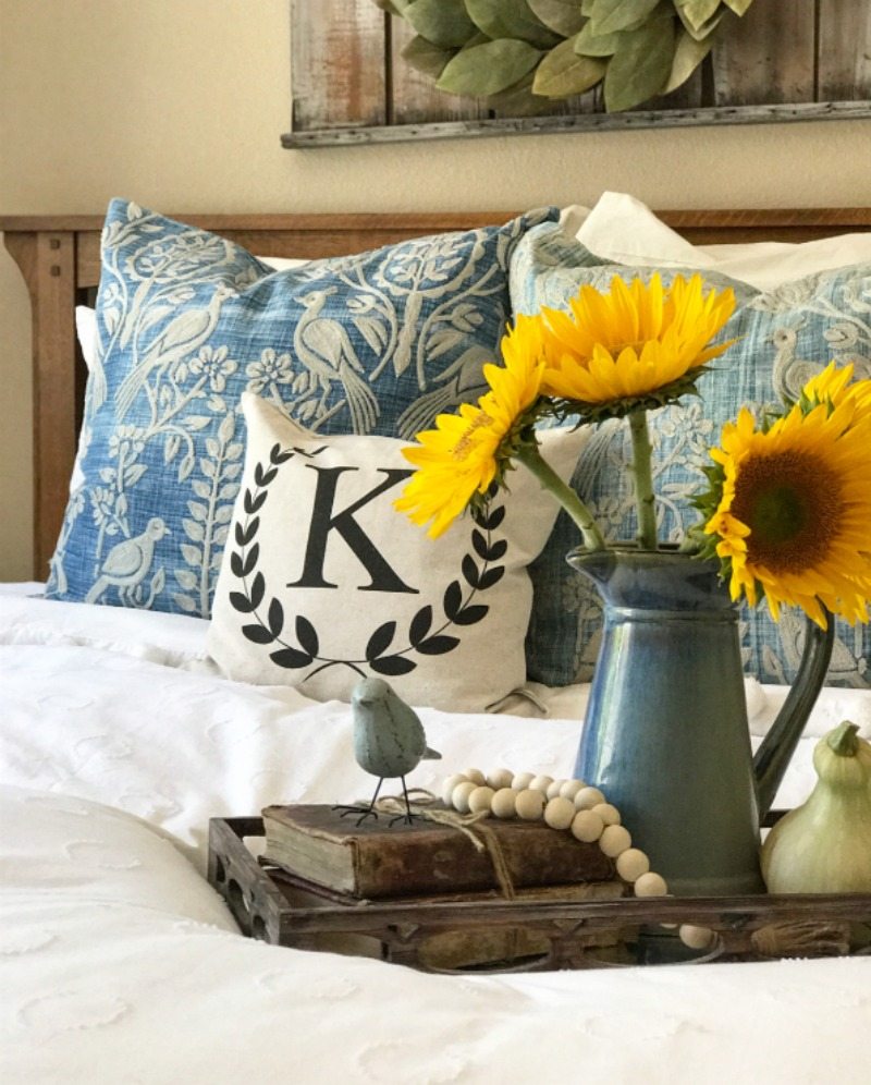 sunflowers and tray on bed