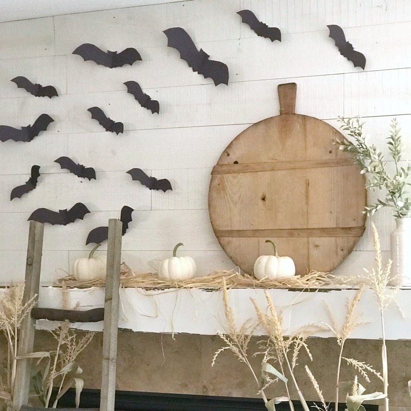 paper bats decorated above fireplace 