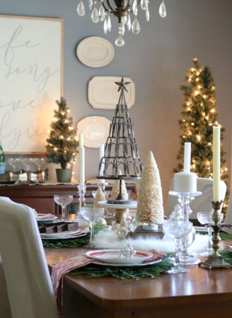 Festive Christmas Table design with elegant elements and mini trees