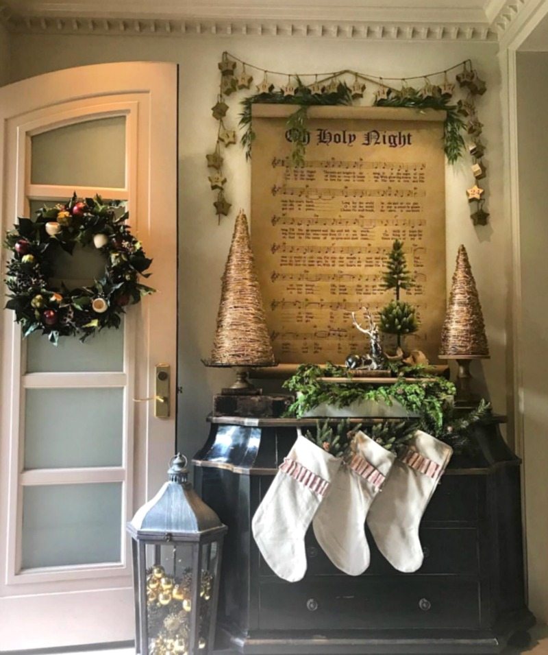 Holiday Home Tour entryway decor with stockings and christmas accents