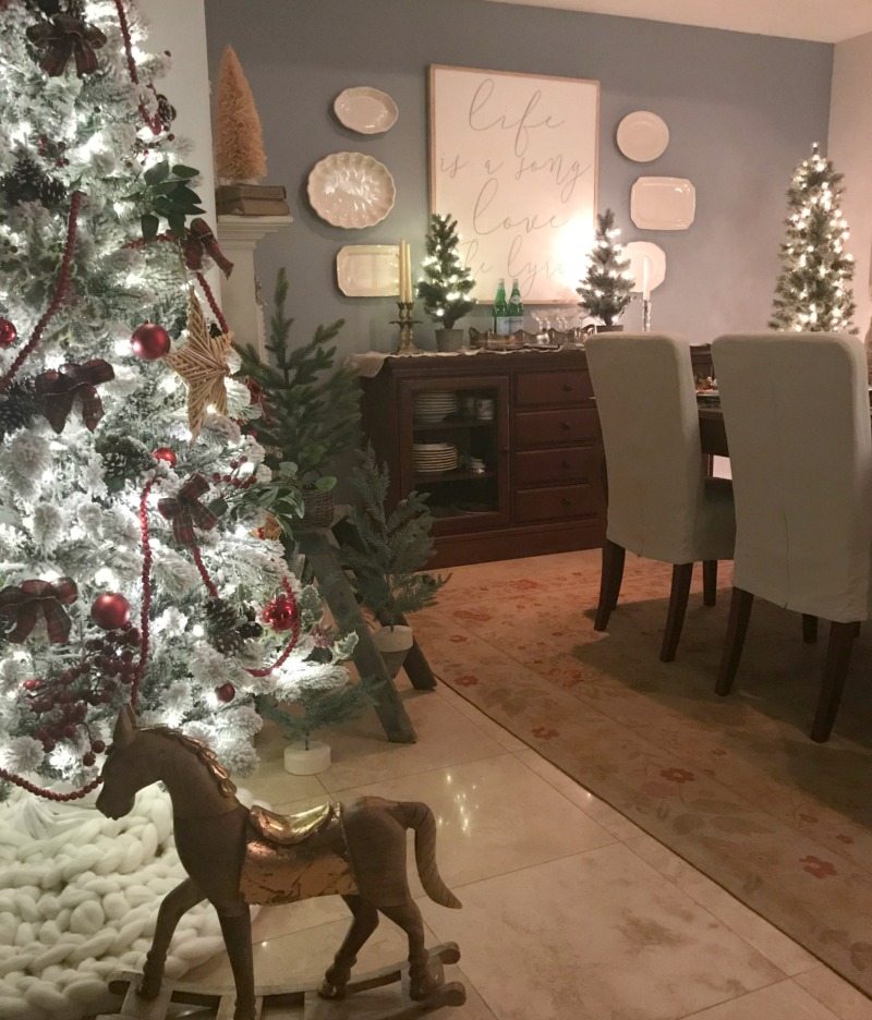 Festive Table Decorations with magical christmas trees and rocking horse