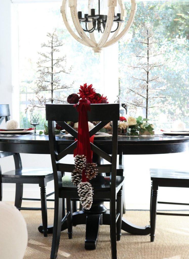 Christmas Home Decor for your dining room with pinecone chair garlands