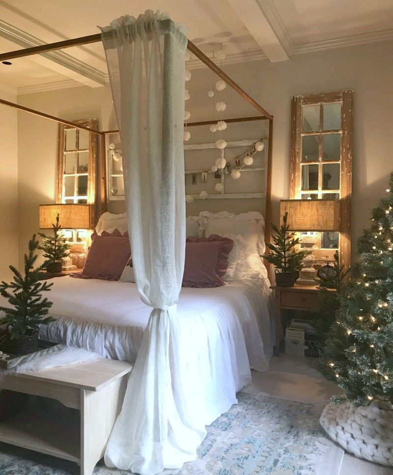 Holiday Home Tour bedroom with pom pom garlands and mini trees