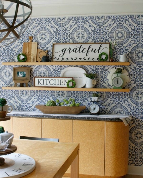 faux tile wallpaper creates beautiful feature wall in dining nook