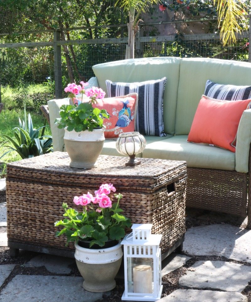 bright patterned pillows create cozy outdoor oasis