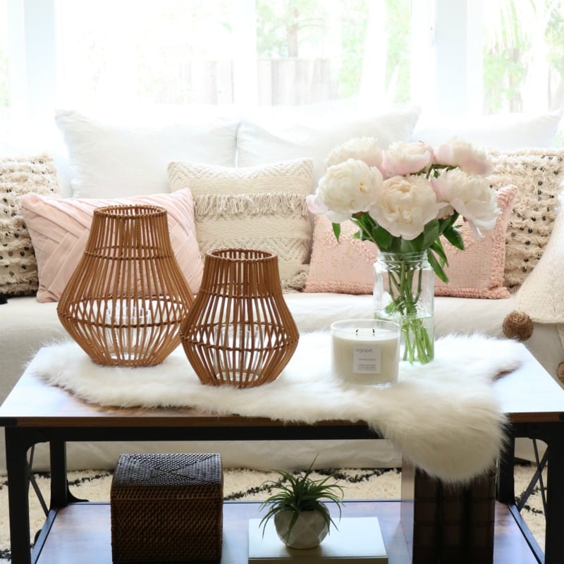 pink decor pillows with accent items and white faux fur throw