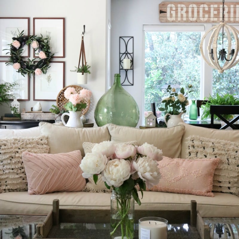 pink decor with pillows and florals