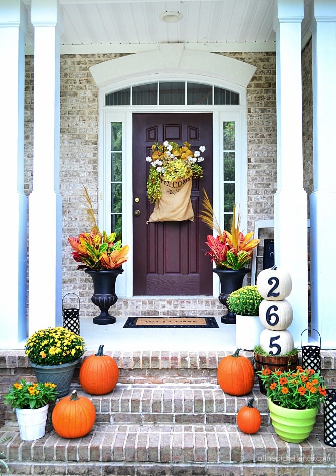 fall front steps with pumpkins and mums