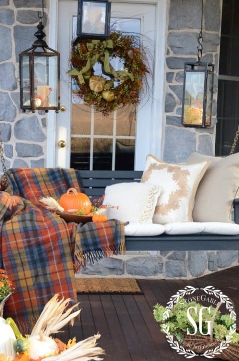 fall front porch with plaids and warm fall colors