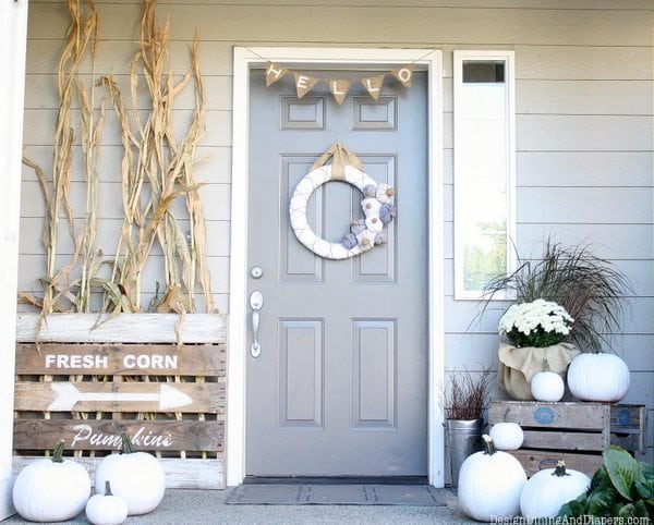 neutral fall front porch with white pumpkins