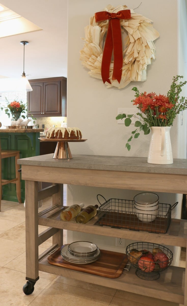 kitchen island with flowers and cake