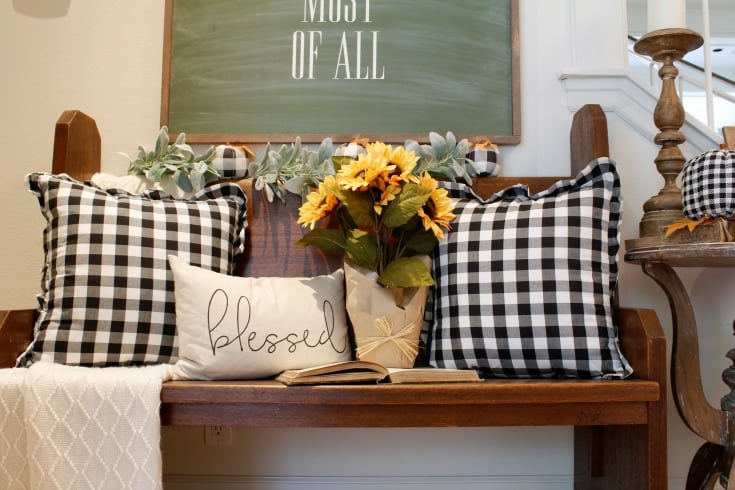 fall pillows black and white on vintage church pew bench