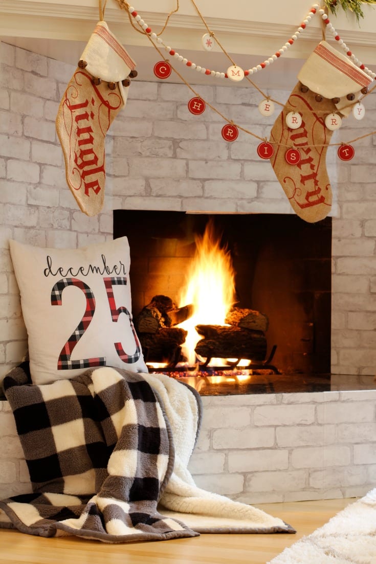 cozy fireplace christmas decor with festive stockings and garlands