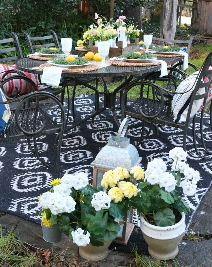 backyard garden party table setting with flowers