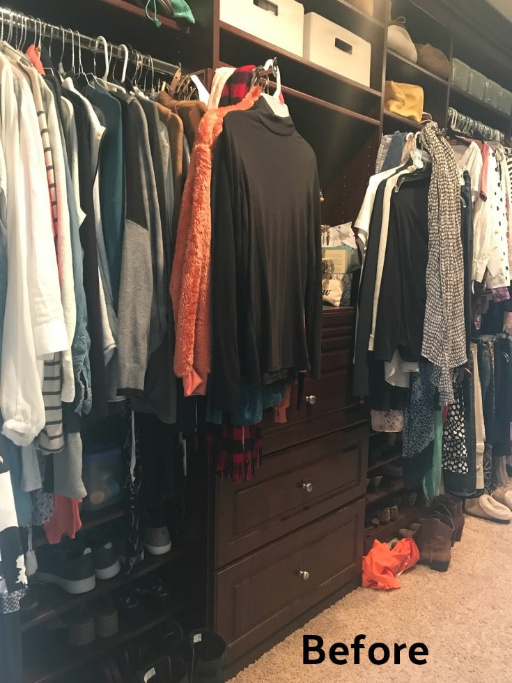 cluttered master closet wood shelves