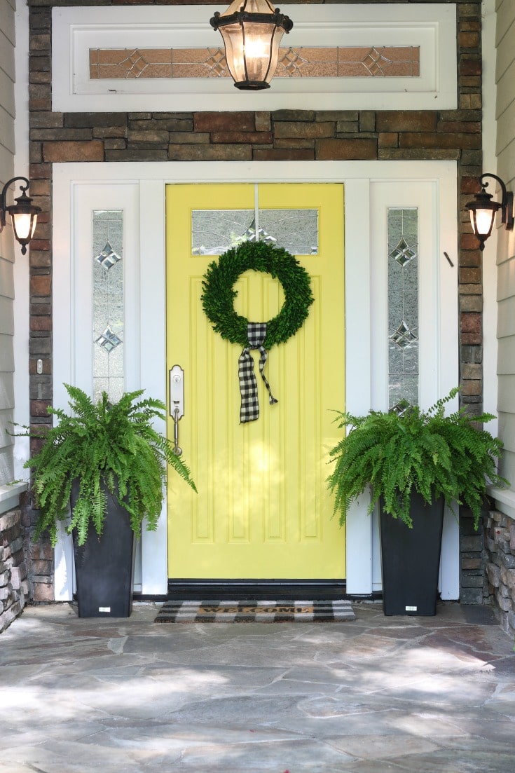 Decorate your front door with ferns for summer decor