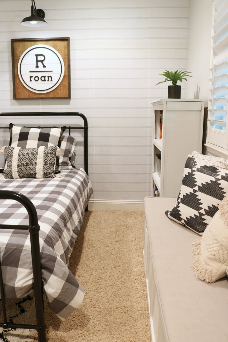 Cool Kids bedroom with neutral colors, mixed patterns and fun pillows