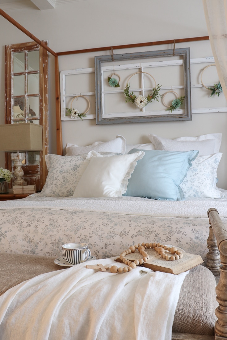 romantic bedding details with floral printed comforter and hoop wreaths sheer curtains