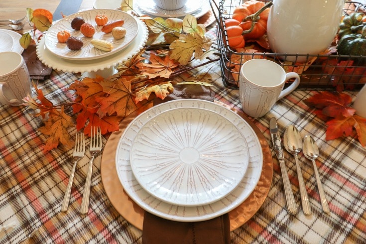 Welcome your guests with a festive fall table updated with the warm cozy colors and scents of the season.