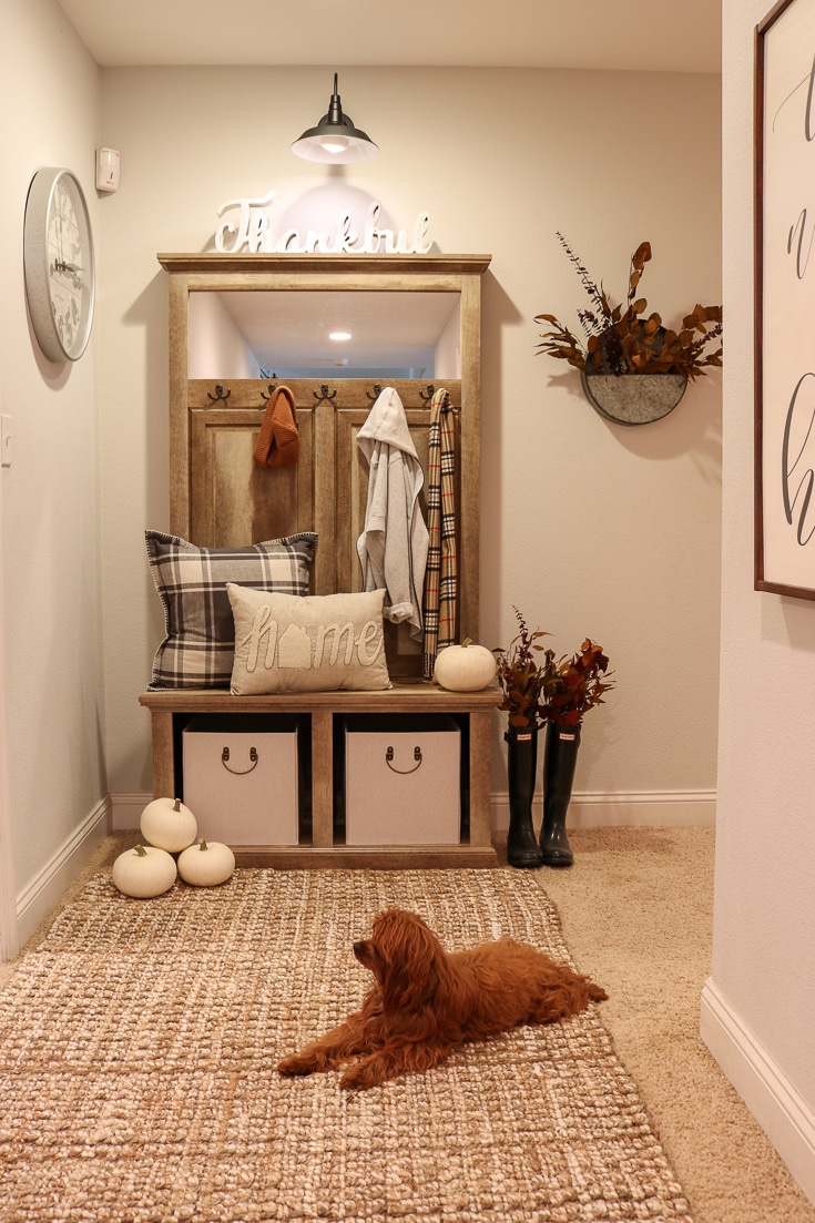 Decorate your entryway with puppy and fall pillows and decor