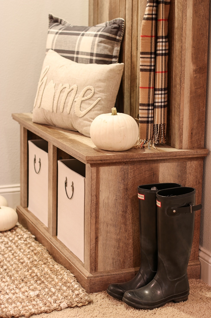 Handy Storage Bins Help Tidy up a Messy Entryway with pumpkins and boots