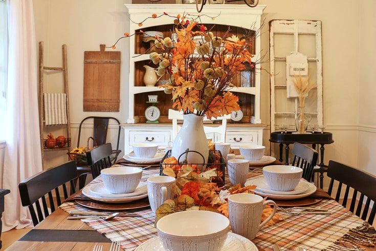 We updated our fall table with warm colorful botanicals, textured plaid linens and cozy scented candles.