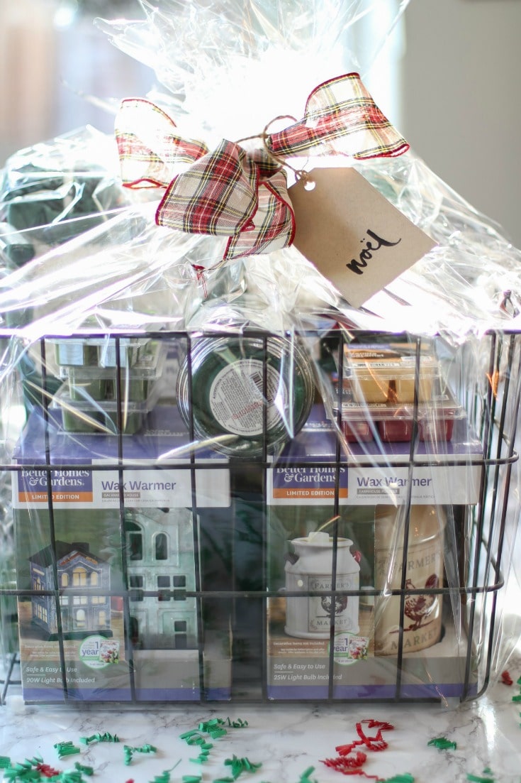 this candle lover's basket is perfect for all candle lovers and includes wax warmers, wax melts and full-sized candles and a cozy blanket