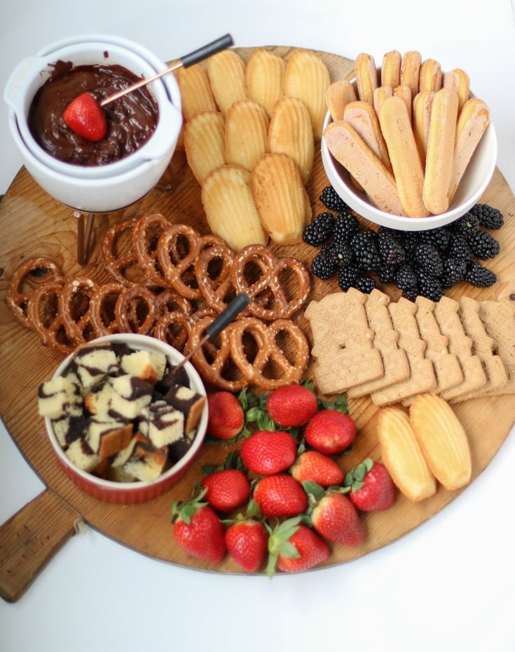 this chocolate fondue charcuterie board is the perfect crowd pleaser for entertaining