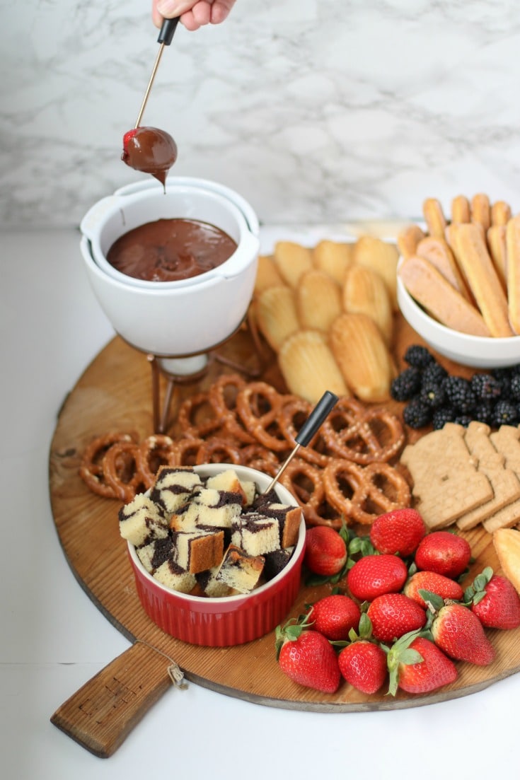 dip strawberries in chocolate for your chocolate fondue charcuterie board