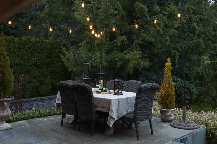 beautiful outdoor patio setting with string lights and dining table