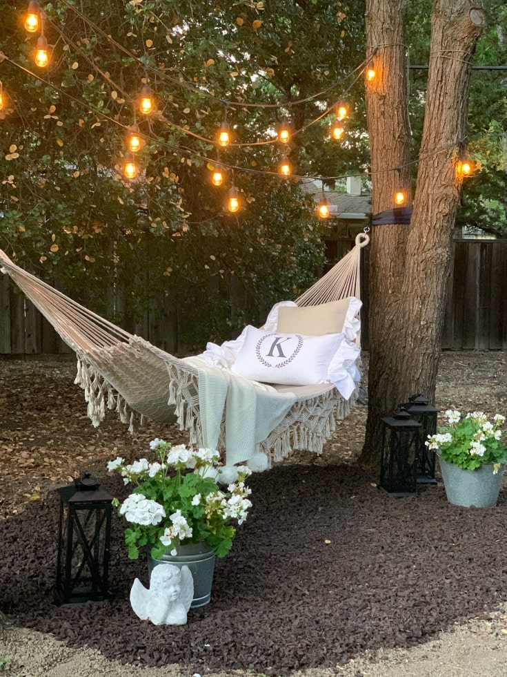 DIY hammock project to liven up your backyard with overhead string lights