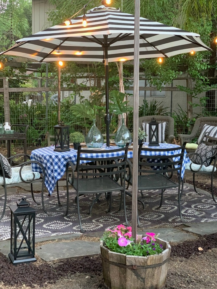 outdoor dining table with overhead string lights